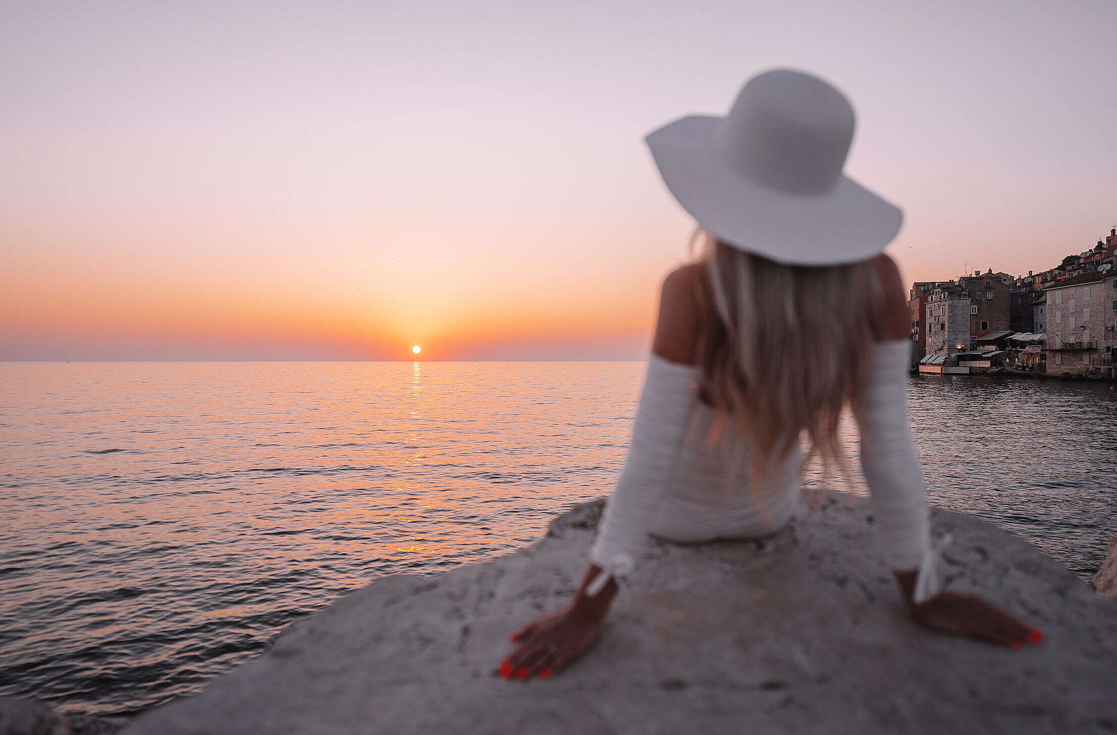 Well Dressed Woman Watching Beautiful Sunset Above the Sea Free Stock Photo
