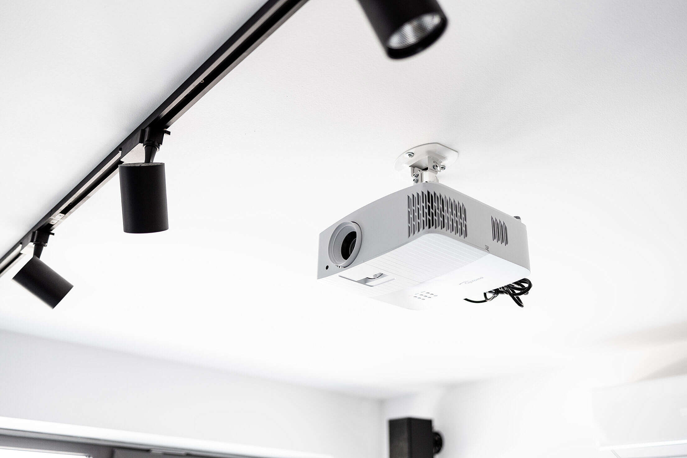 White 4K Projector Attached to Ceiling Free Stock Photo