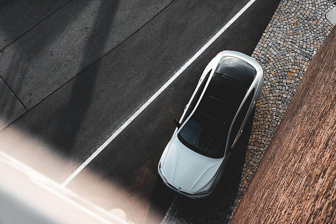 White Modern Car with Black Roof Top View