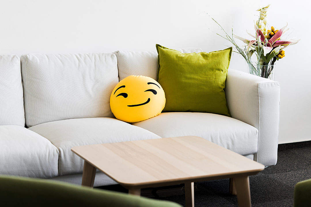 Download White Office Couch with Funny Emoji Pillow FREE Stock Photo