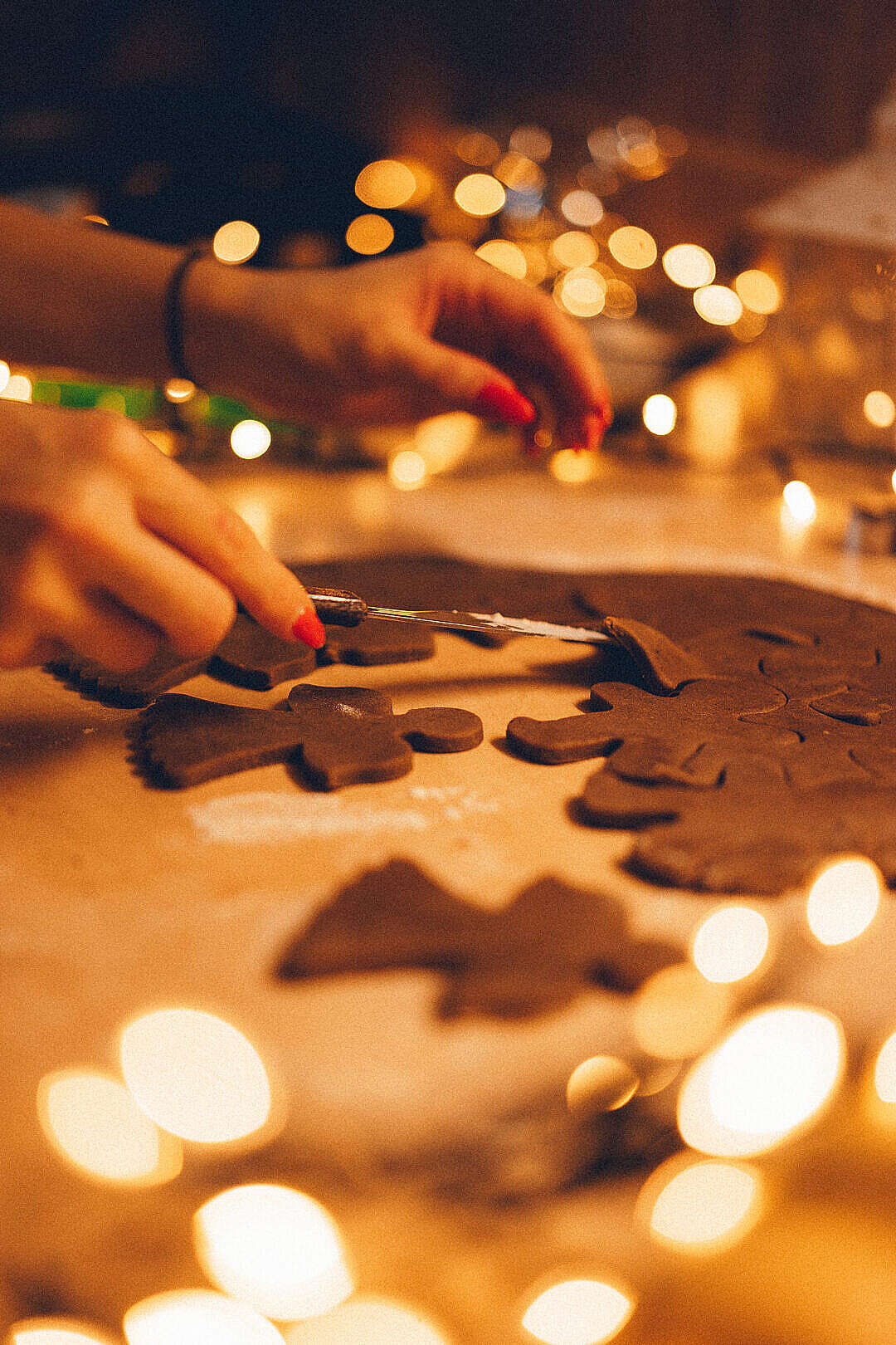 Download Woman Cutting Gingerbread Cookies FREE Stock Photo