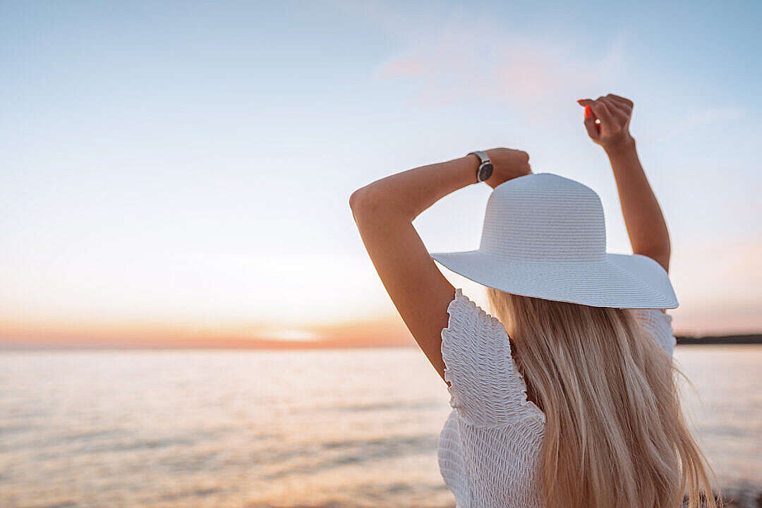 Woman Dancing and Enjoying Beautiful Sunset