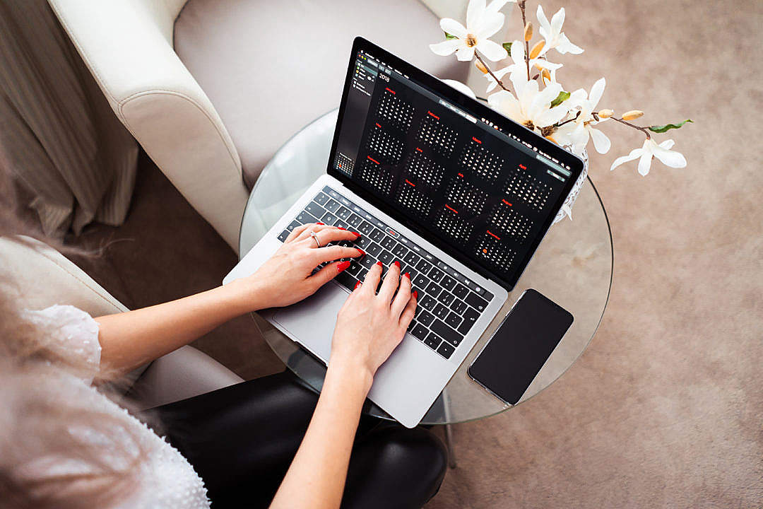 Woman Entrepreneur Working on Her Modern Laptop