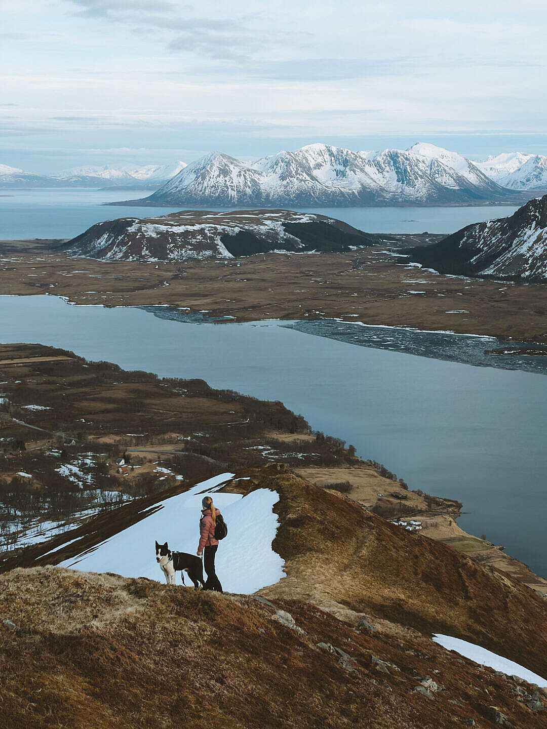 Woman Hiking with Husky Dog and Enjoying the View