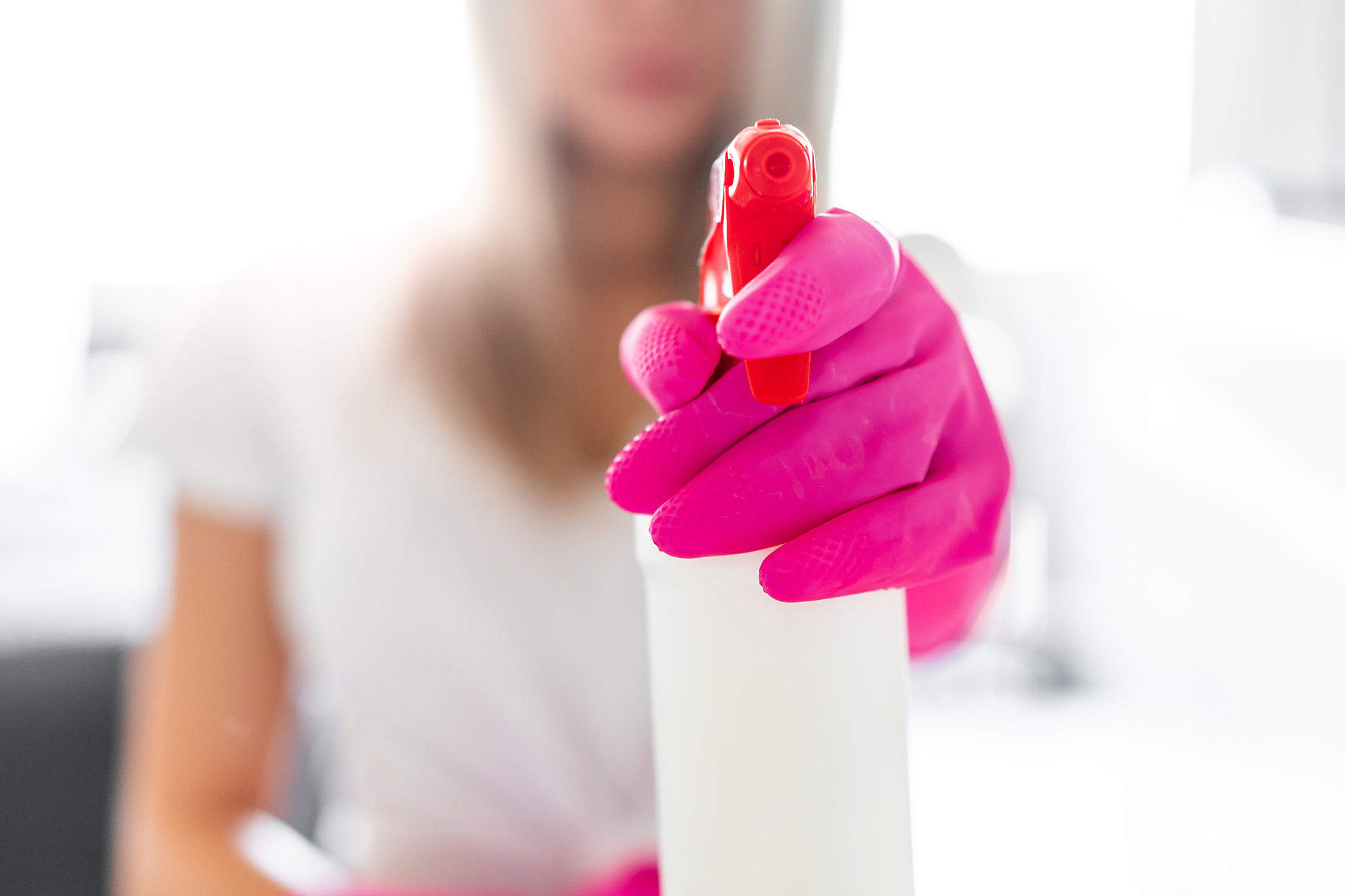 Woman Holding a Detergent Spray Bottle Free Stock Photo
