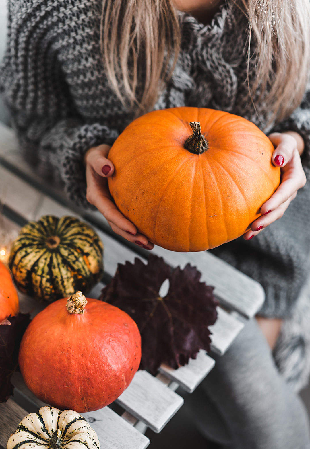 Woman Holding a Halloween Pumpkin