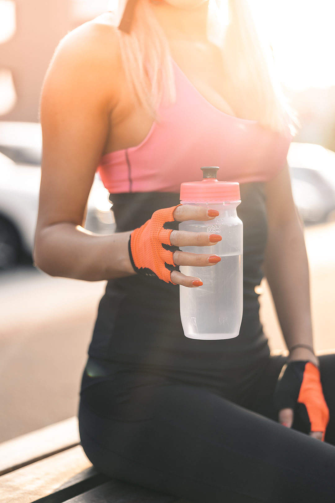 Woman Holding a Sports Bottle