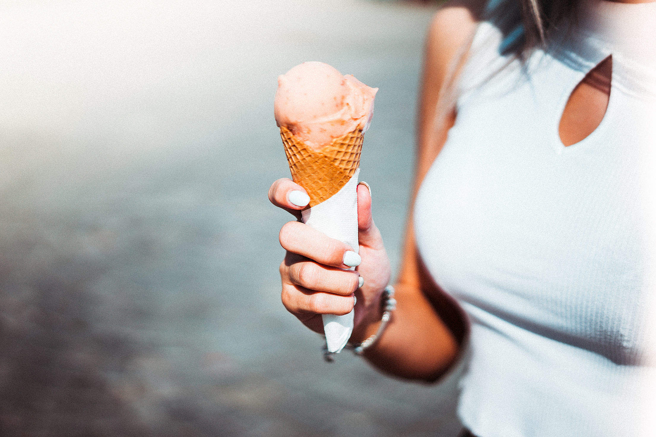 Woman Holding an Ice Cream Free Stock Photo