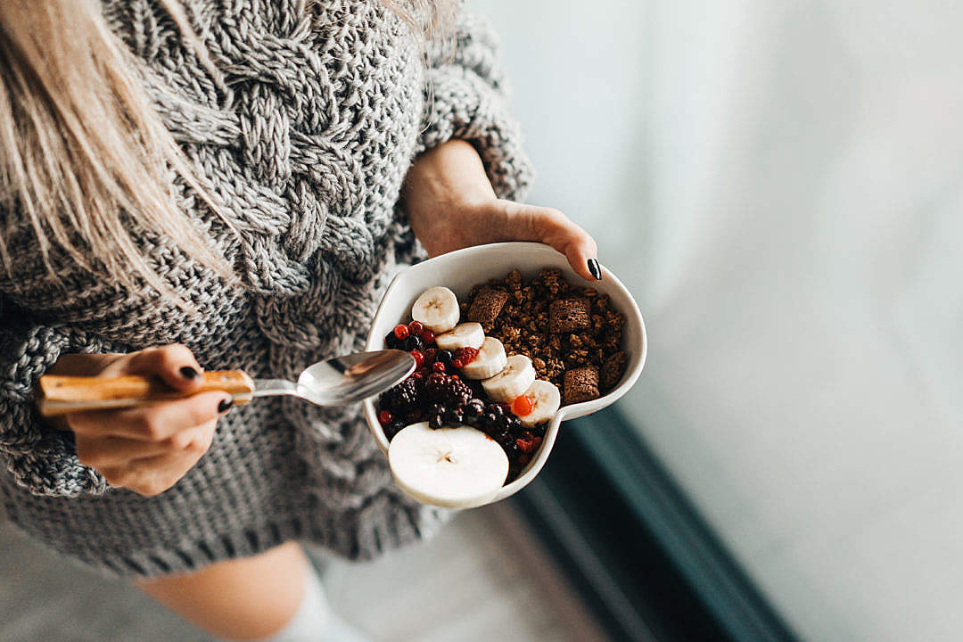 Download Woman in Knitted Sweater Enjoying Morning Breakfast FREE Stock Photo