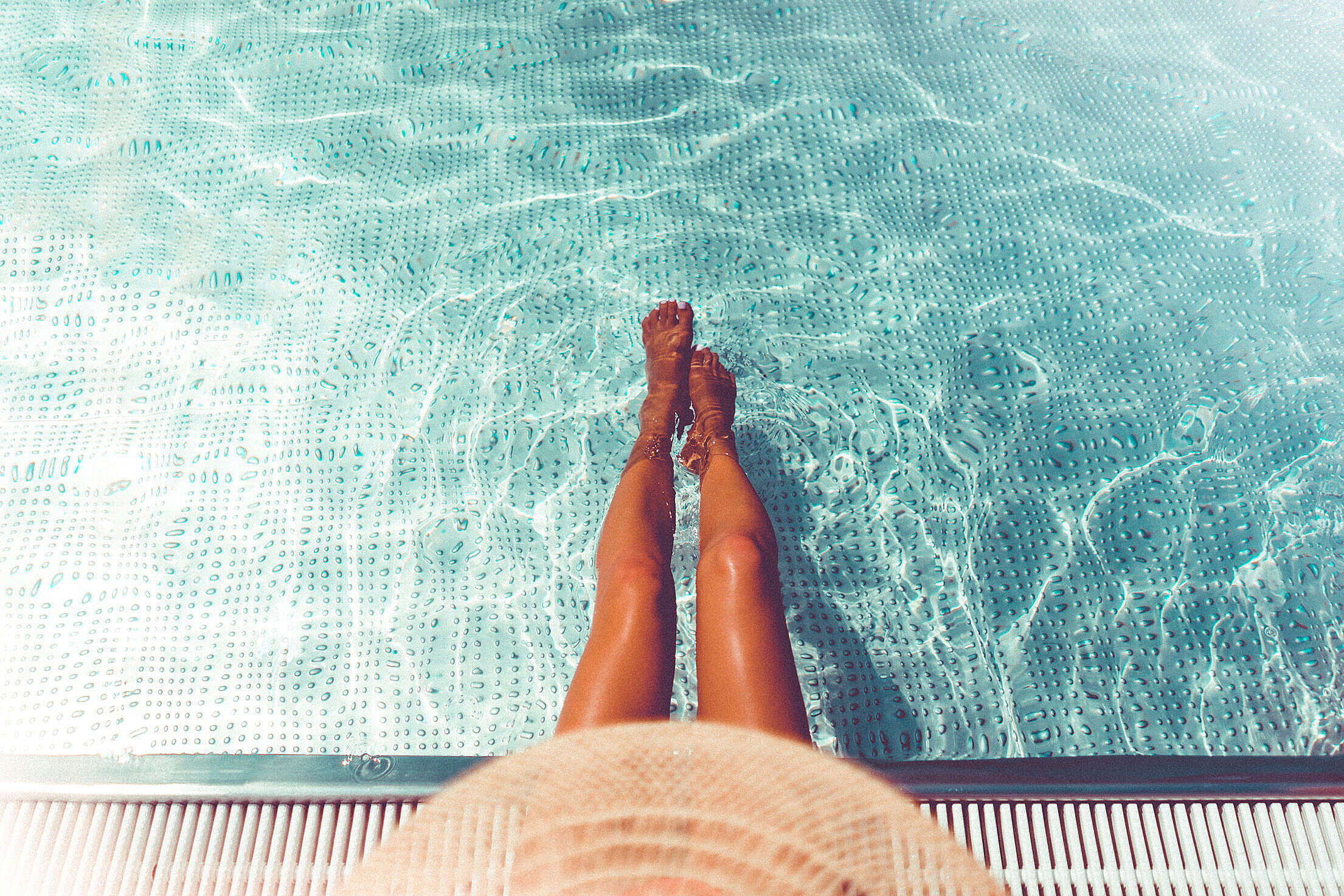 Woman Legs in Swimming Pool Free Stock Photo