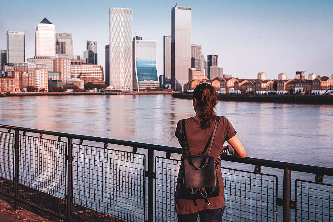 Woman Looking at Canary Wharf Business District Skyscrapers