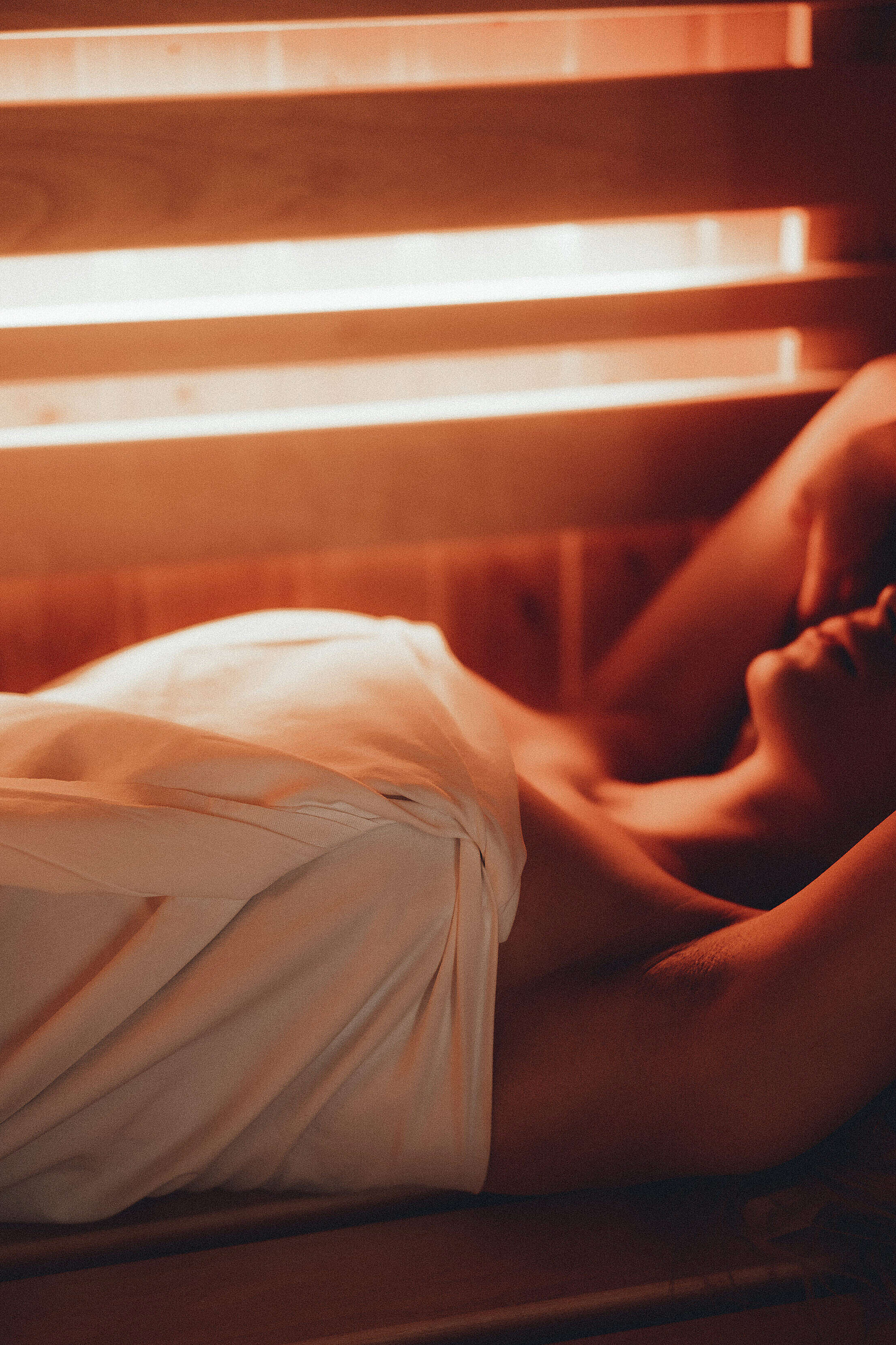 Woman Lying in a Finnish Sauna Close Up Vertical Free Stock Photo