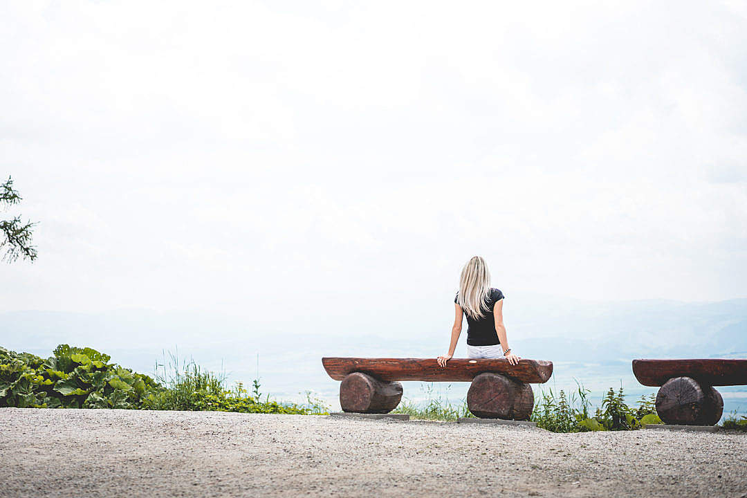 Download Woman Sitting on a Bench Place for Text FREE Stock Photo