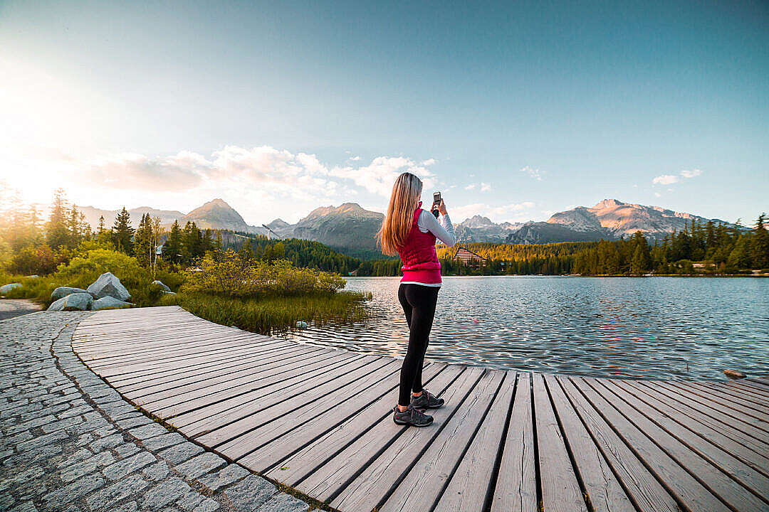 Woman Traveler Taking a Photo of Tremendous High Tatras, Slovakia