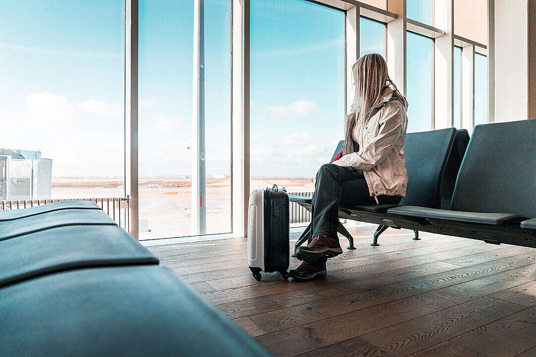Woman Traveler Waiting at Icelandic Airport