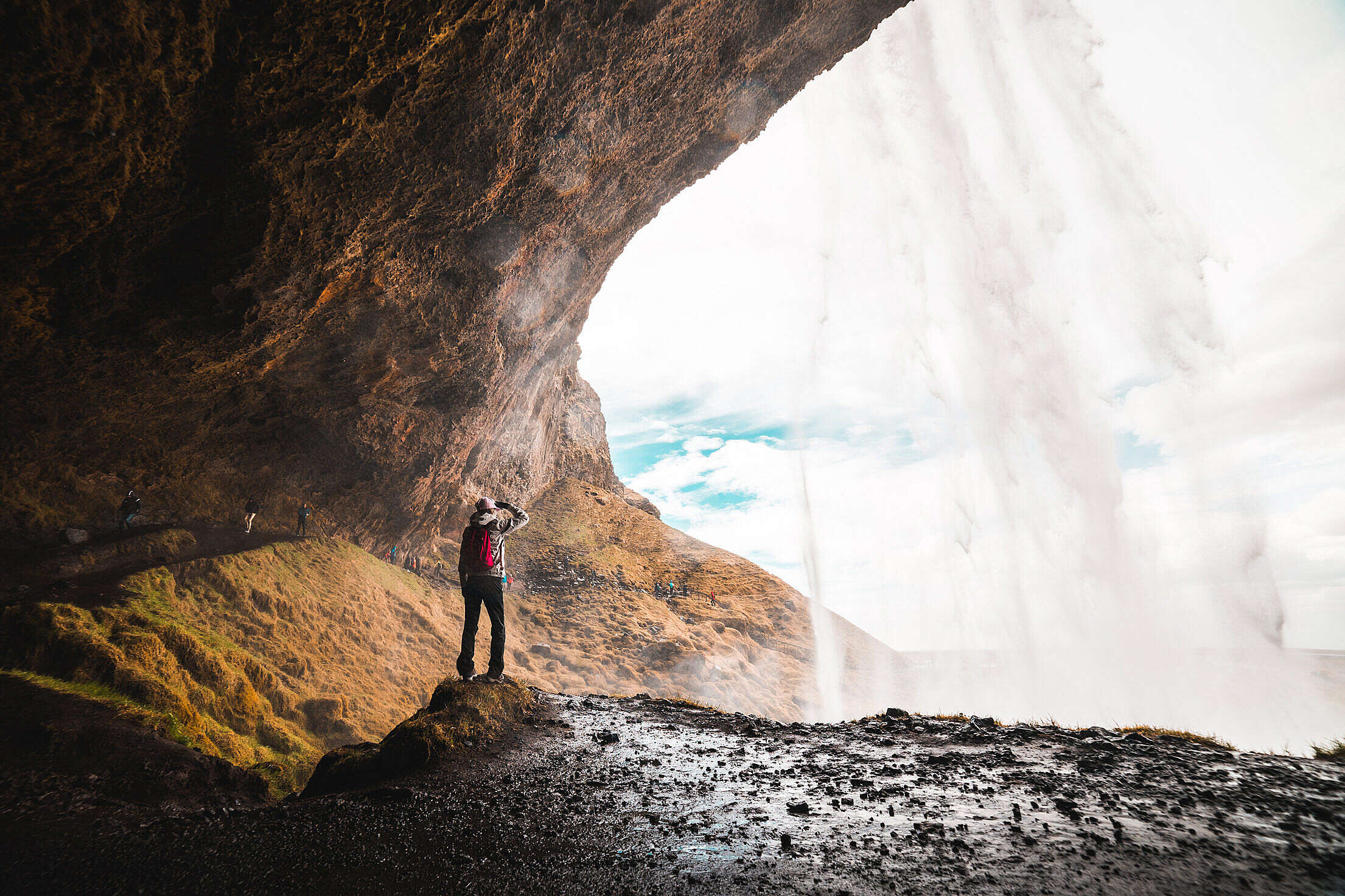 Woman Under Seljalandsfoss Waterfall, Iceland Free Stock Photo