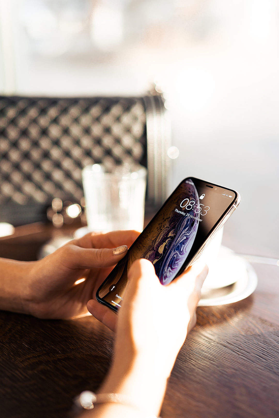 Woman Using a Modern Smartphone in Café