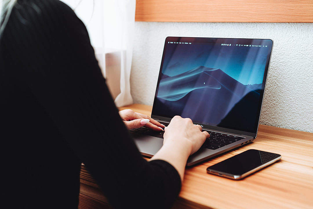 Woman Using a New Laptop