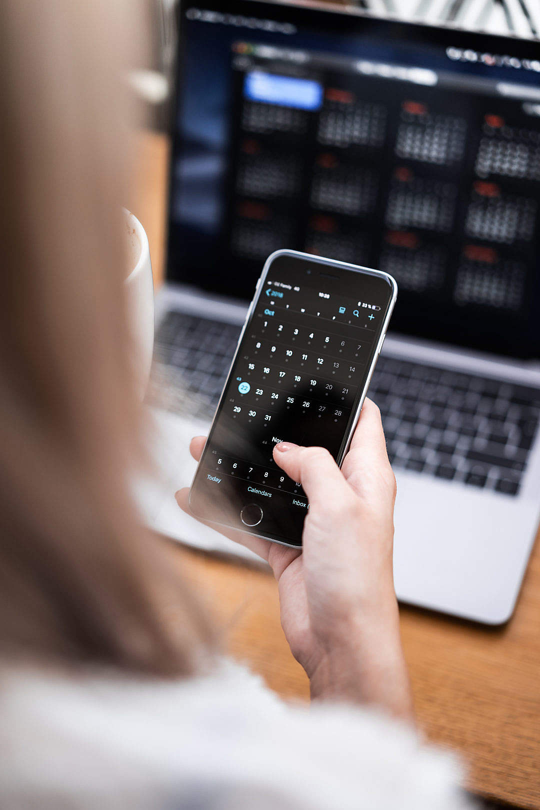 Woman Using Inverted Colors Dark Mode on iPhone