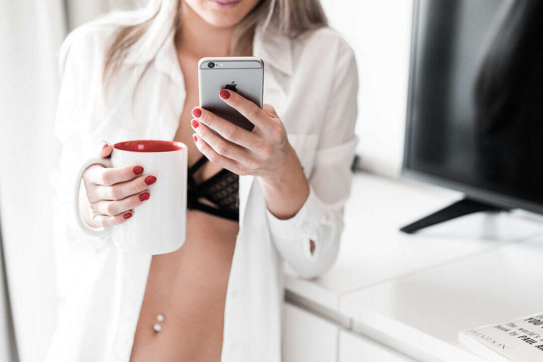 Woman Using Smartphone at Home