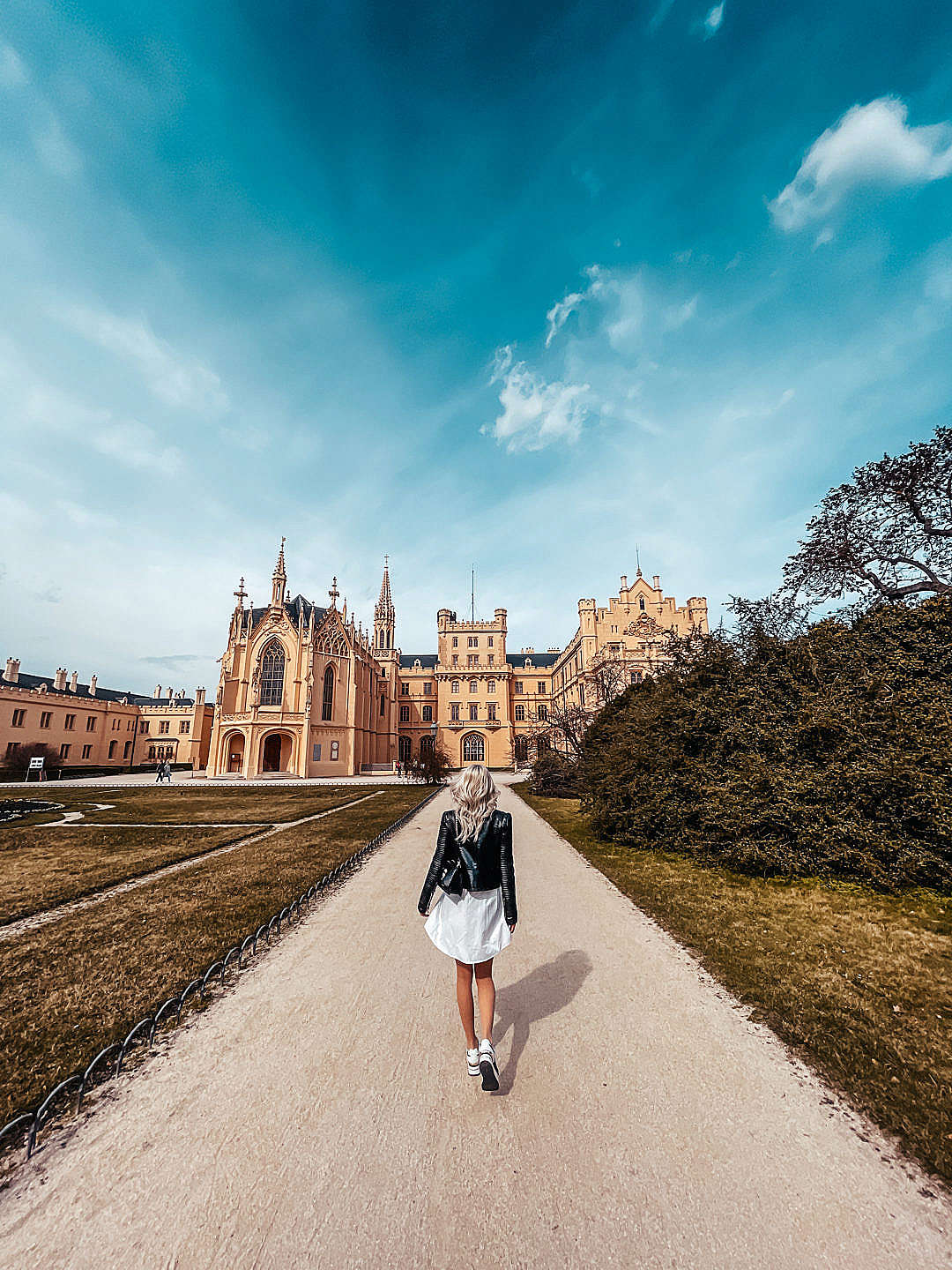 Woman Walking in Lednice Park to Visit Lednice Castle, Czechia