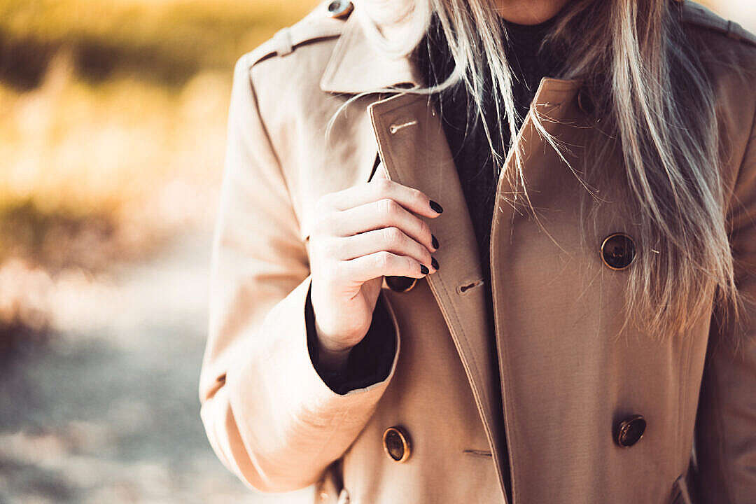 Woman Wearing an Elegant Brown Coat