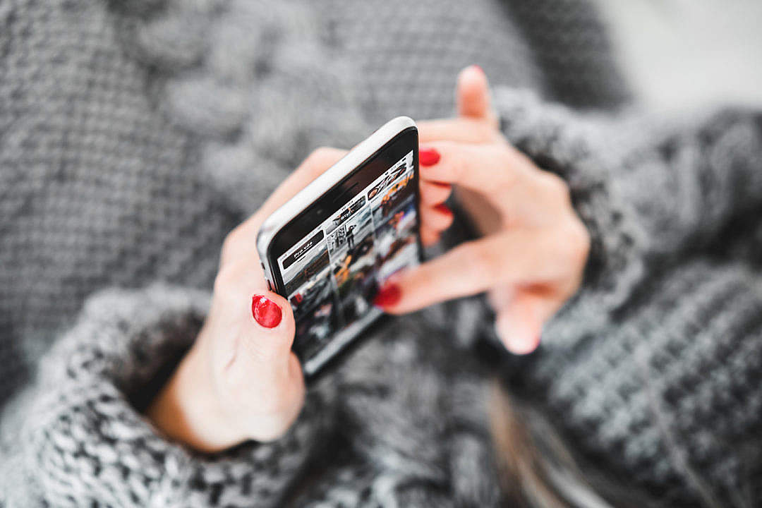 Woman with Smartphone in Hands