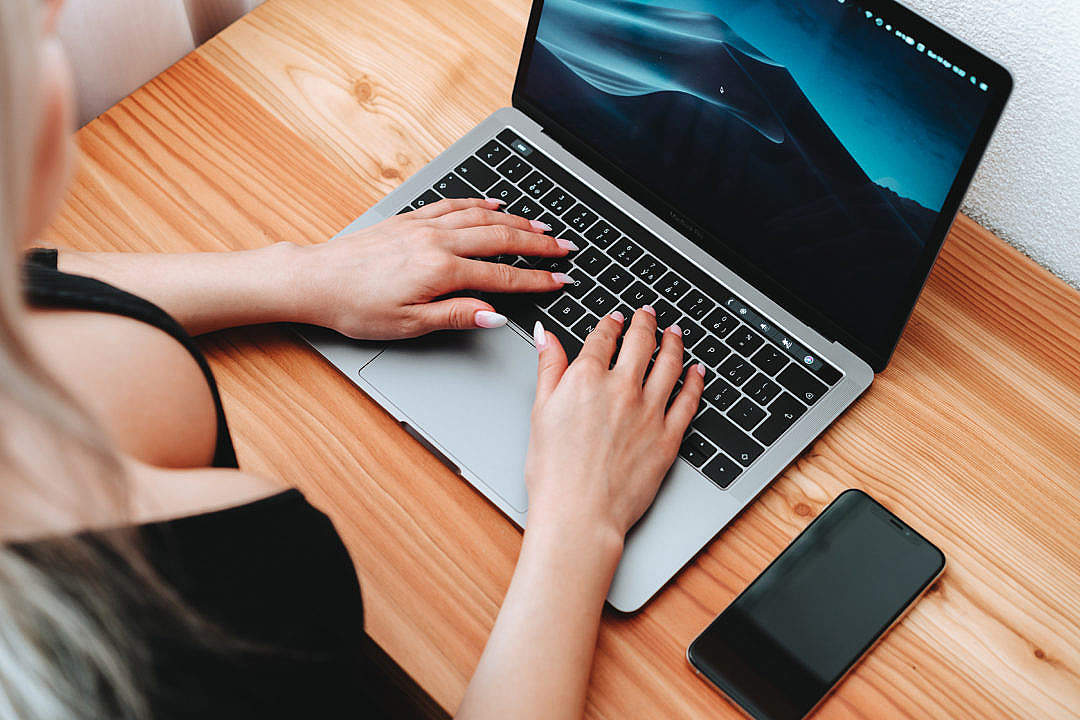 Woman Writes on MacBook