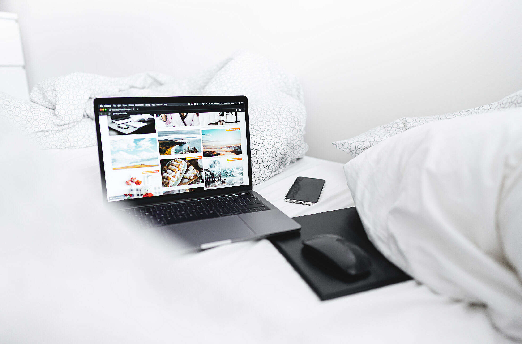 Working from a Bed Free Stock Photo