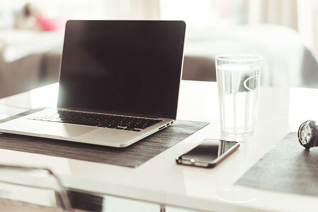 Download Working from Home with MacBook and iPhone FREE Stock Photo