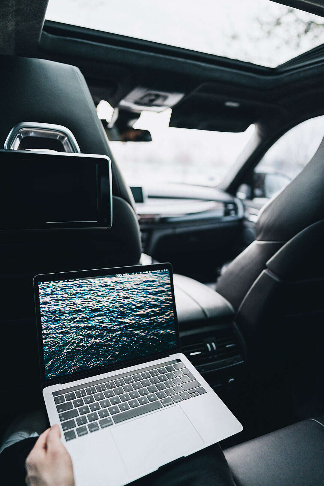 Working on a MacBook on Rear Seats in a Car