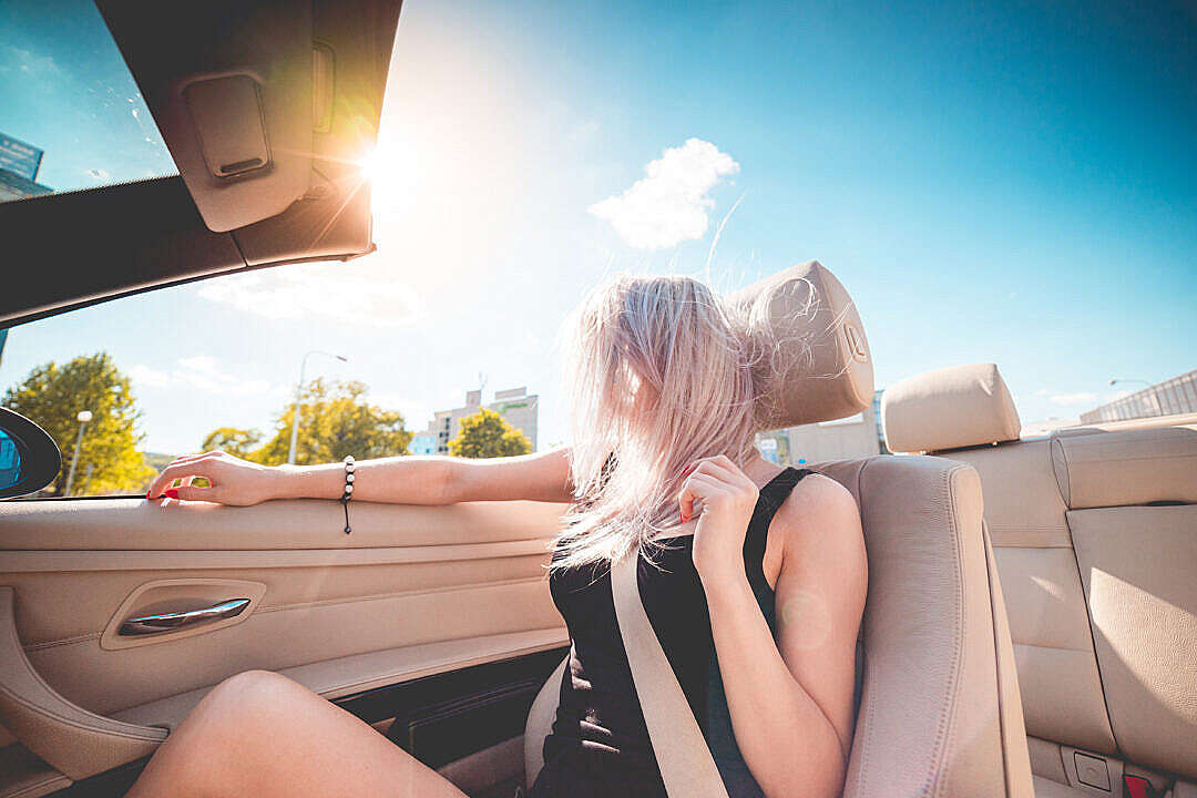 Download Young Blonde Girl on Summer Ride in Convertible FREE Stock Photo
