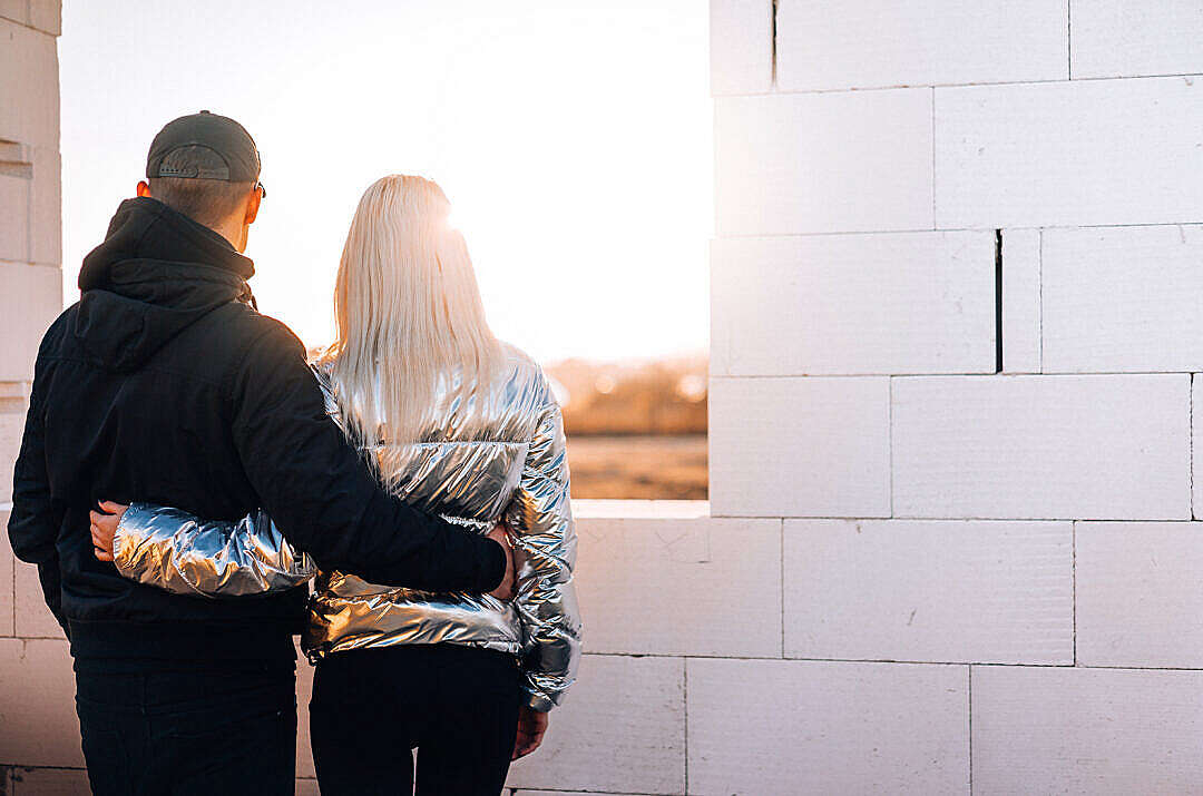 Young Couple Looking Out of The Future Window