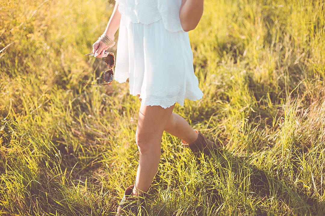 Download Young Girl Enjoying Her Free Time In a Sunny Meadow FREE Stock Photo