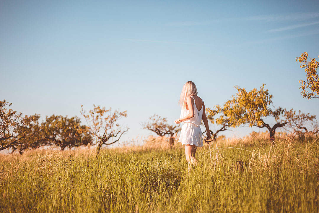 Download Young Girl Lost in a Meadow FREE Stock Photo