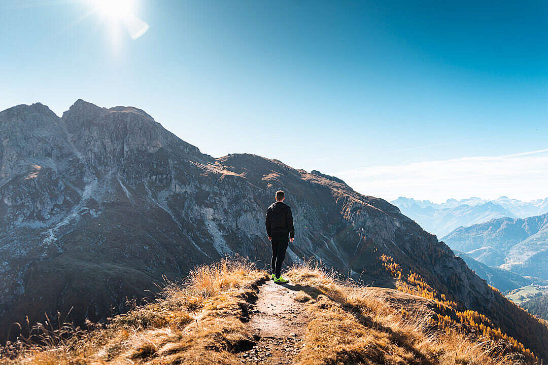 Young Man Climbed The Mountain Top