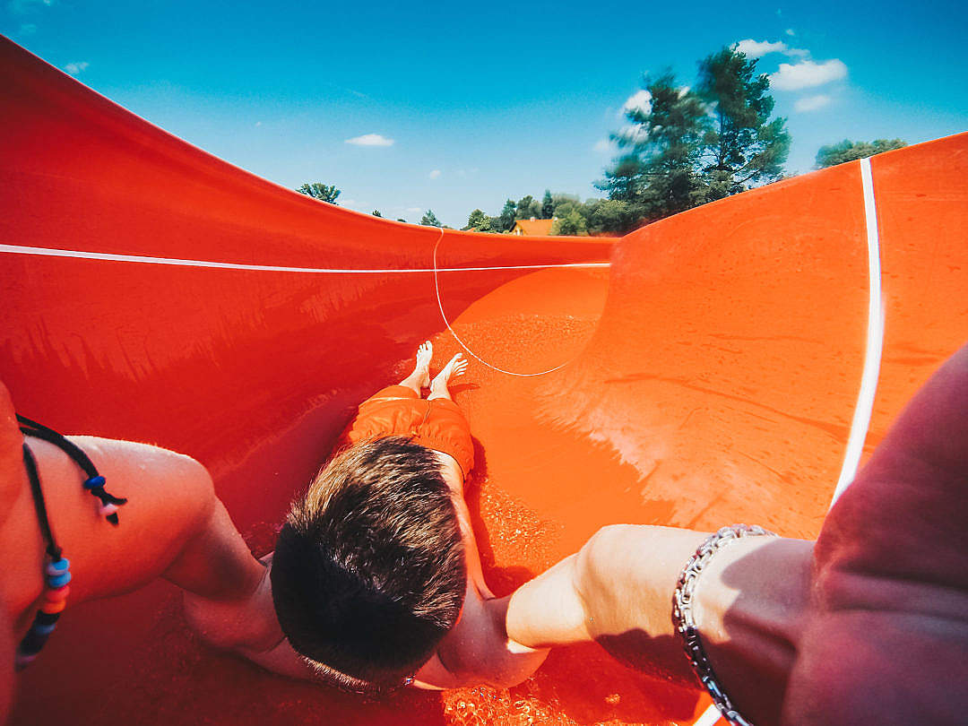 Young Man Enjoying Outdoor Water Slide