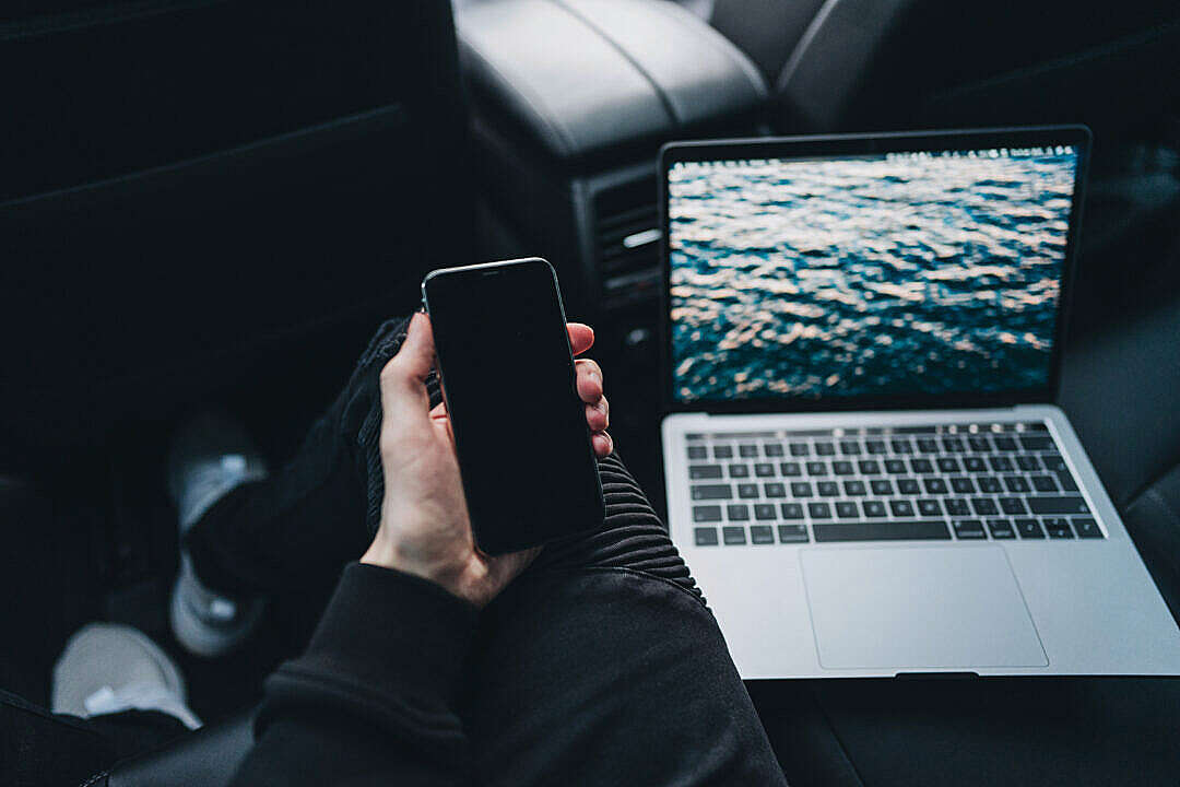 Young Man Working from a Car