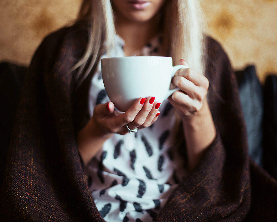Download Young Woman Drinking a Tea FREE Stock Photo