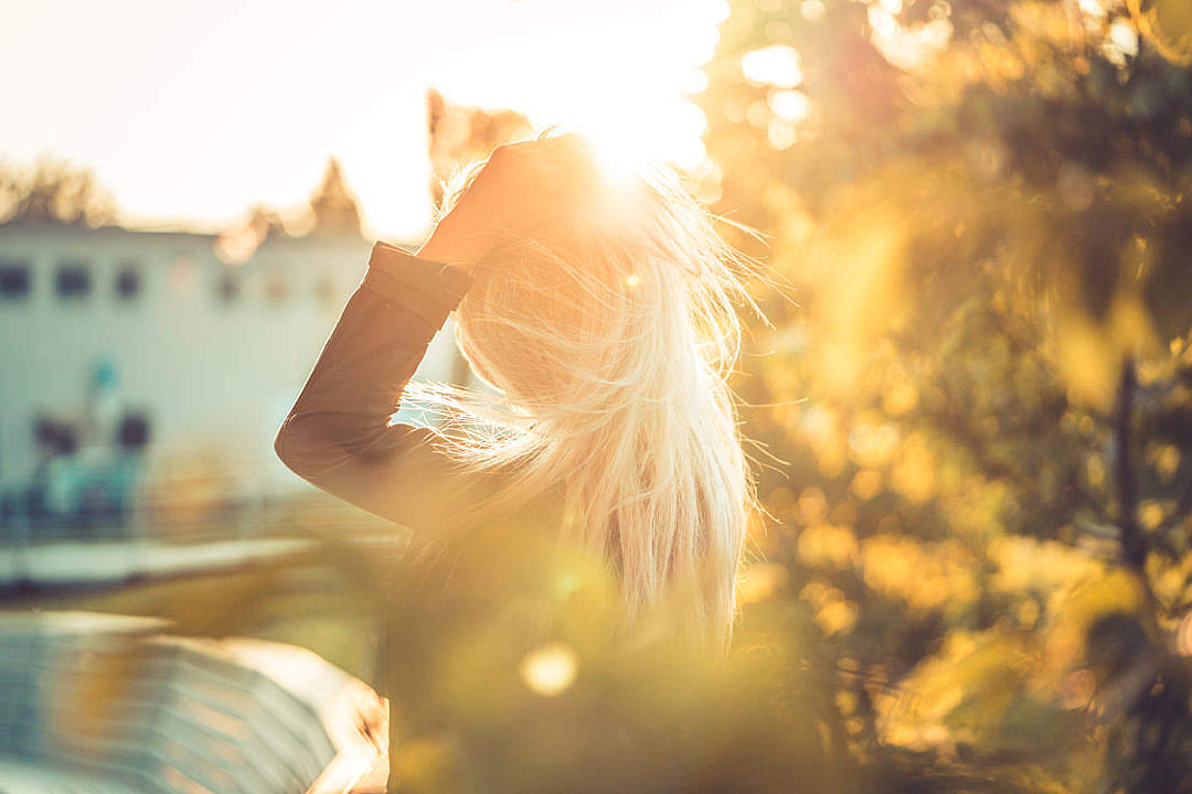 Young Woman Emotionally Touching Her Hair