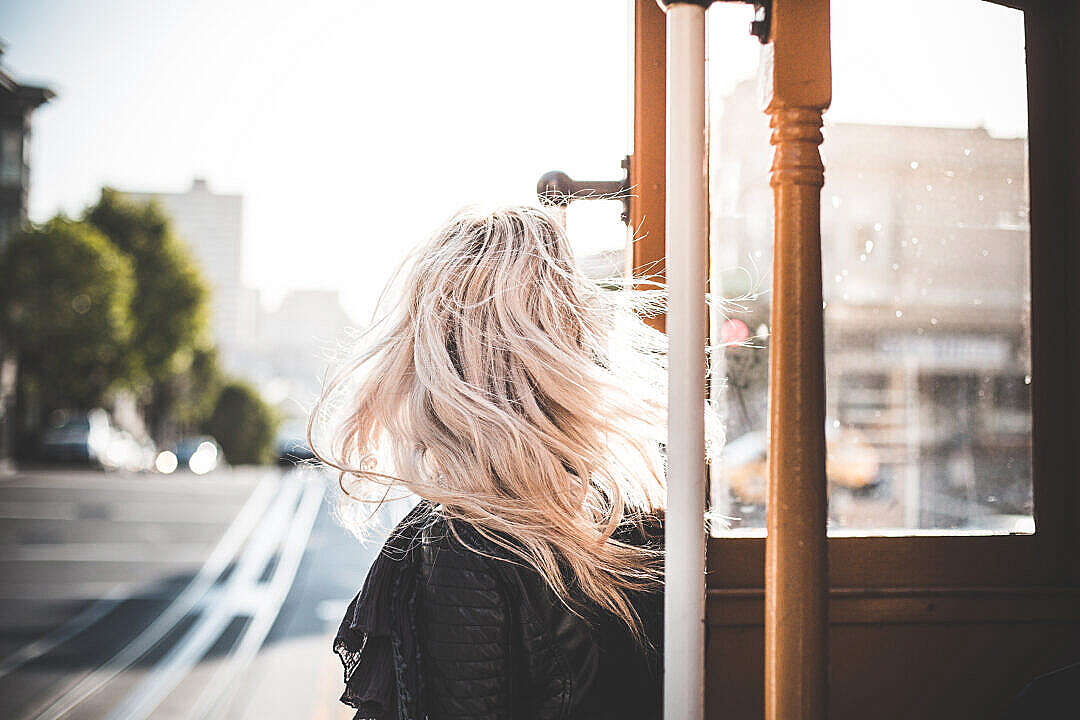 Young Woman Enjoying Ride on an Iconic Cable Car in San Francisco #2