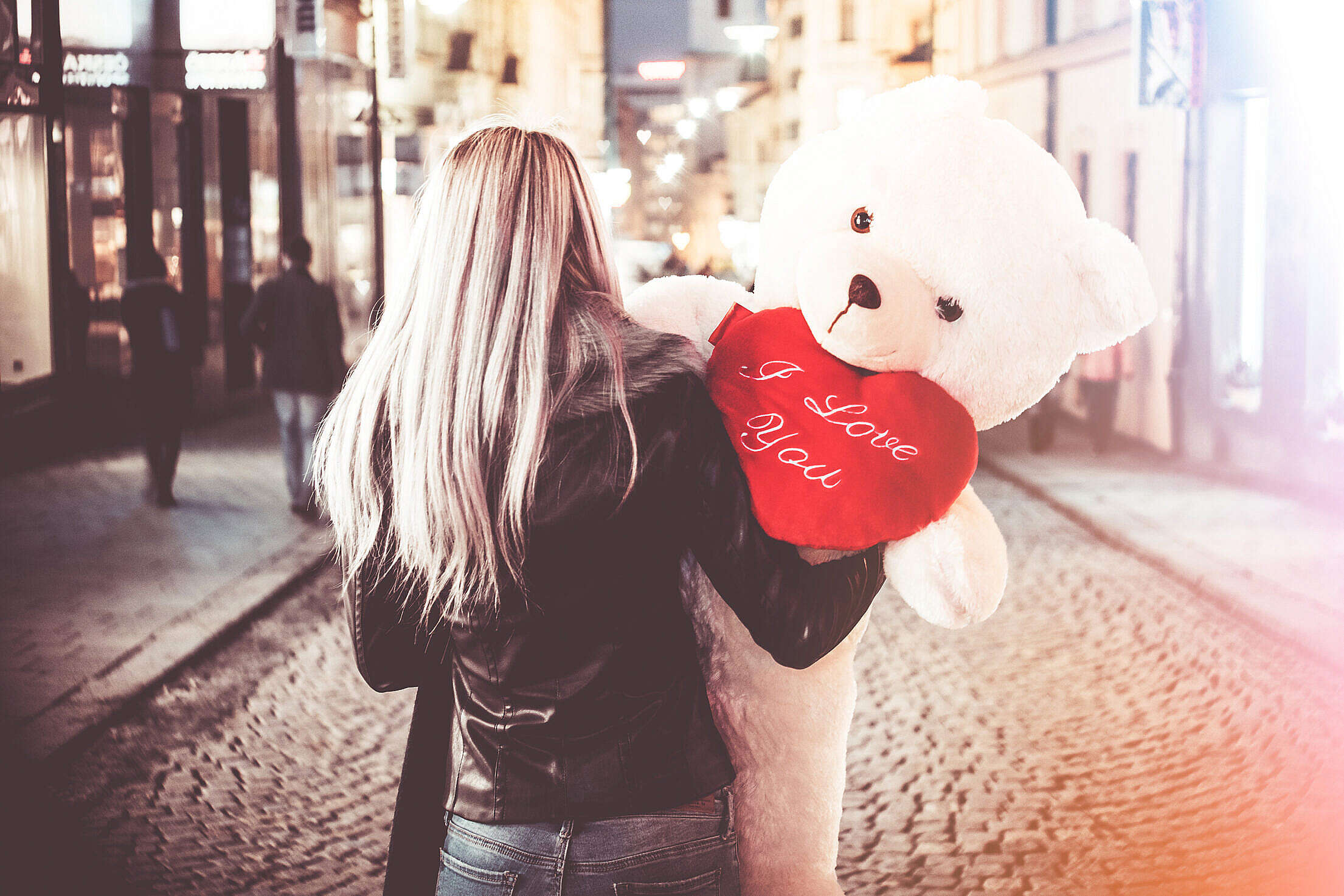 Young Woman Holding Her Big Valentine’s Day Gift Teddy Bear Free Stock Photo