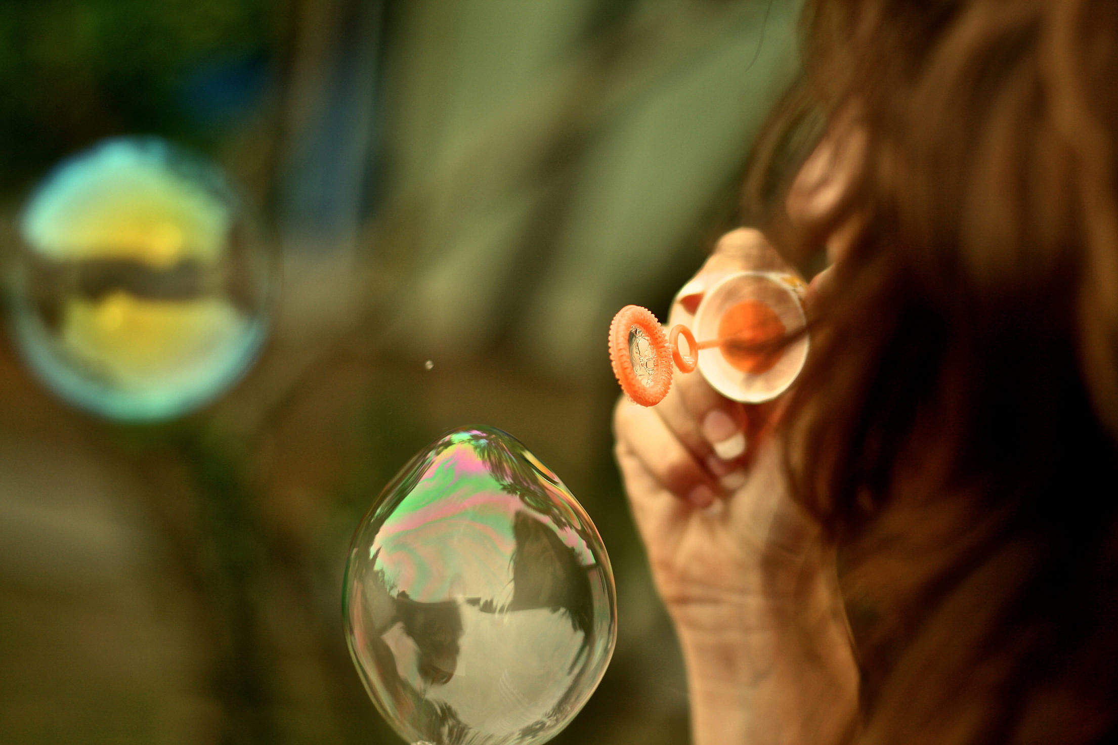 Young Woman Making Bubbles Free Stock Photo