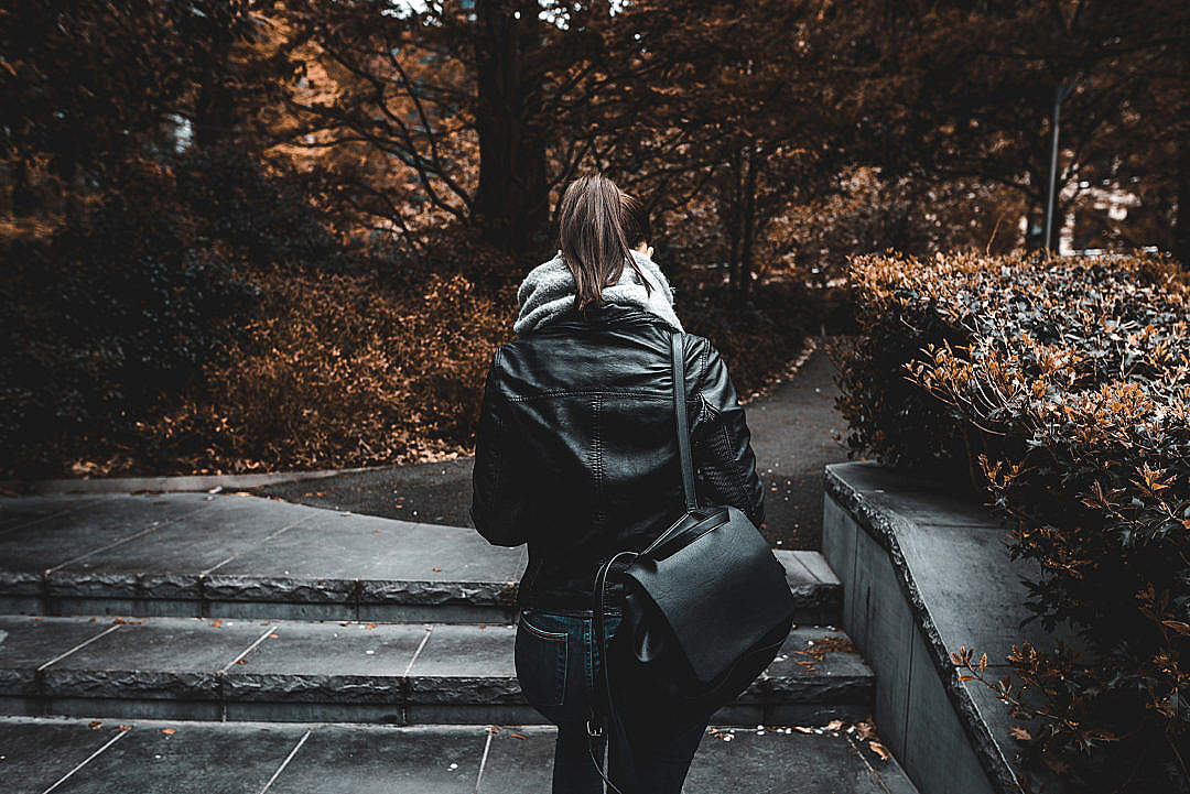 Young Woman Walking Alone in Park