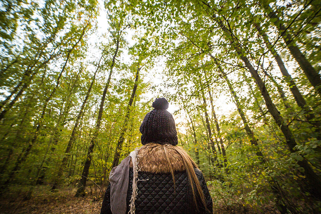 Download Young Woman Walking Through The Forest FREE Stock Photo
